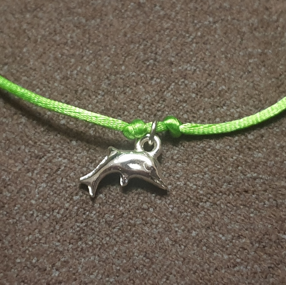 Dolphin for good luck adjustable green string